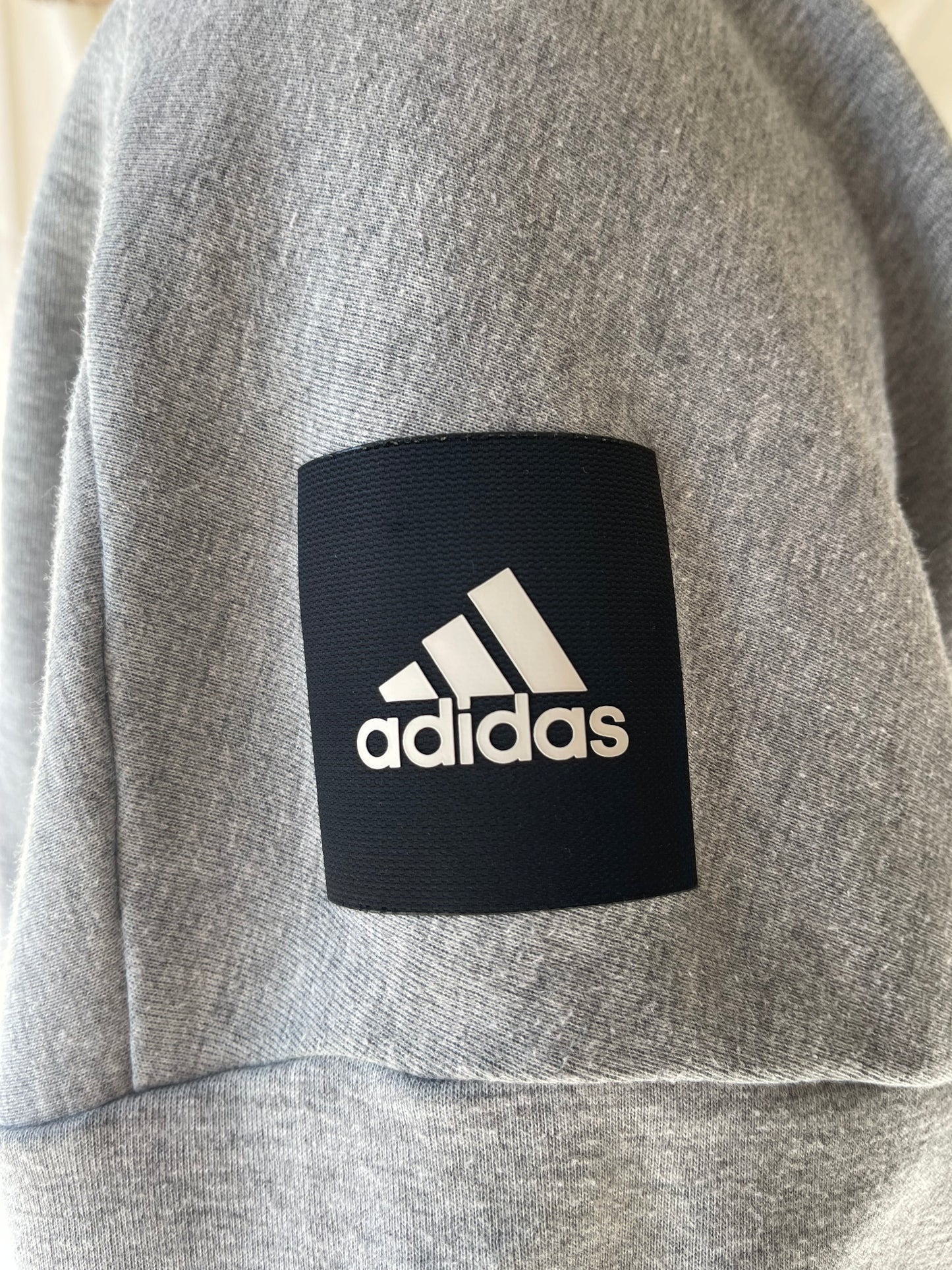light grey Adidas sweatshirt