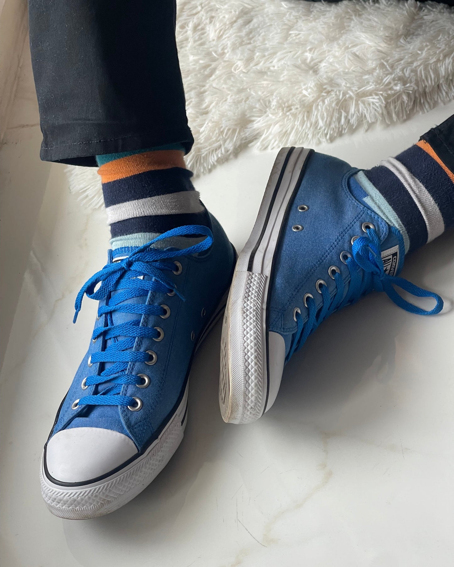 blue low-top Converse shoes