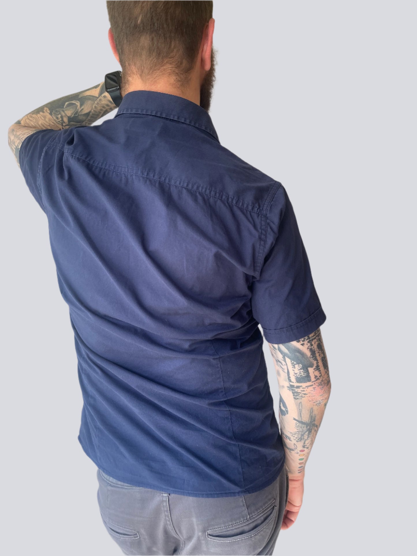 navy blue short-sleeve shirt by Pierre Cardin
