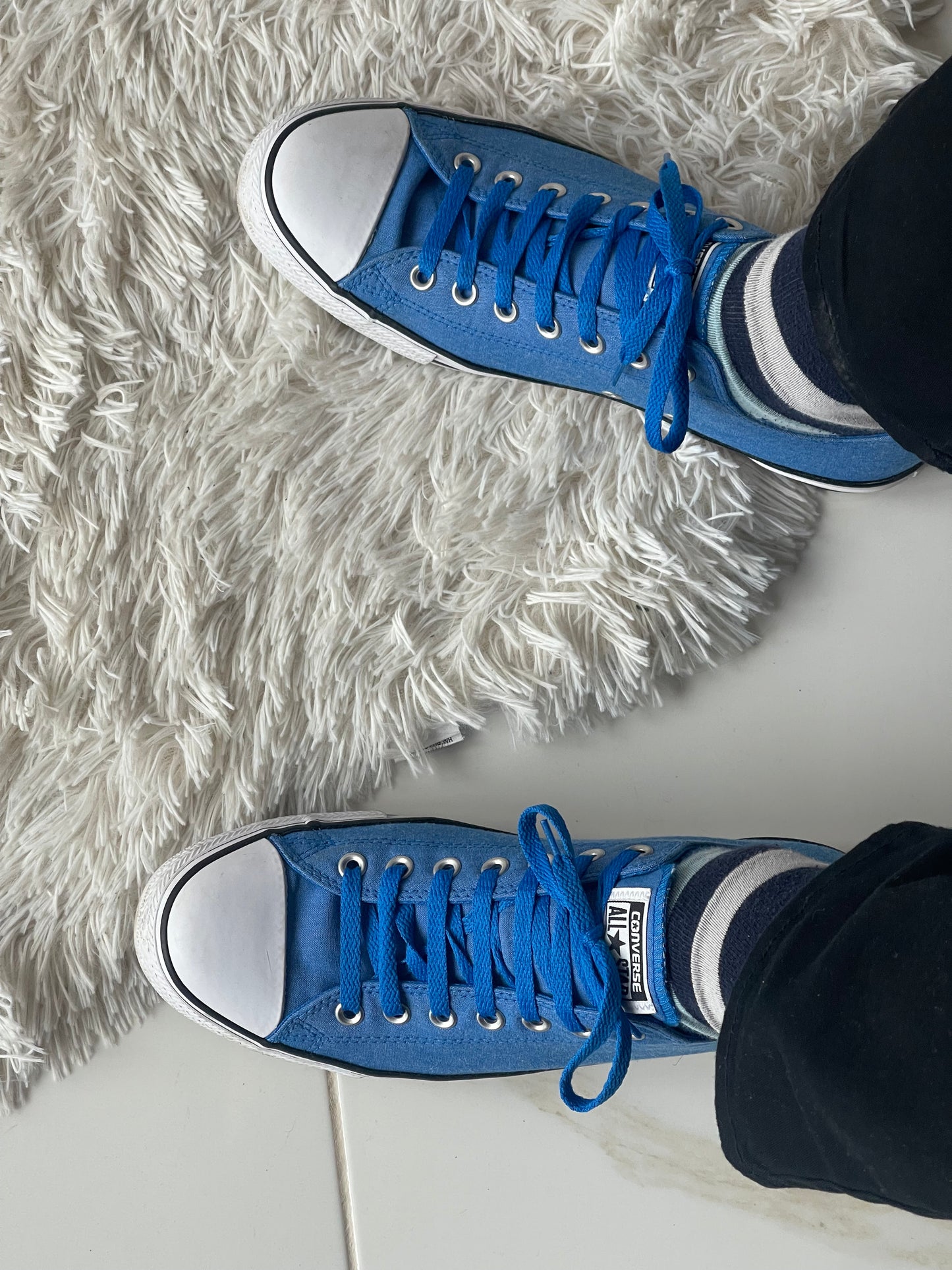 blue low-top Converse shoes