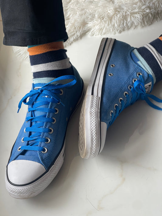 blue low-top Converse shoes