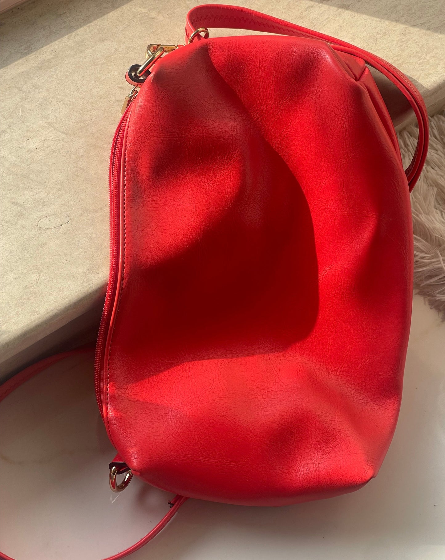 red hot faux-leather handbag